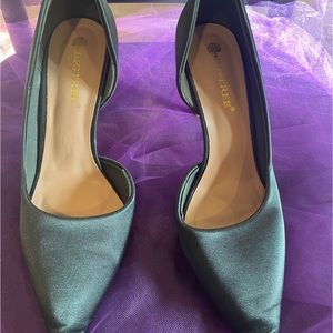 Green satin D’Orsay heels.